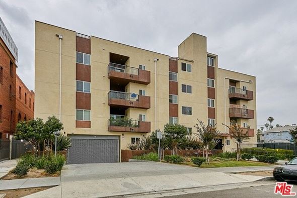 Los Angeles apartment for rent - A multi-story apartment building with a garage door in front.