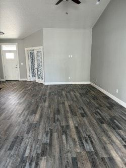 Hermiston house for rent - A room with a wooden floor and a ceiling fan.