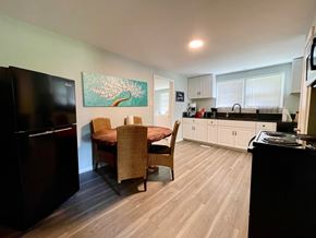 Charlestown house for rent - A kitchen with a dining table and chairs.