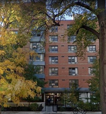 Brooklyn apartment for rent - A tall apartment building with a bicycle parked in front.