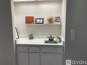 Winter Park condo for rent - A small kitchen with a white counter and a sink.