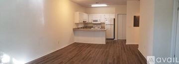 Santa Rosa Beach apartment for rent - A kitchen area with white cabinets and a countertop.