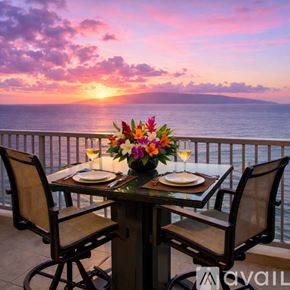 Lahaina house for rent - A living room with a bar area and a view of the ocean.