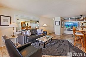 Lahaina house for rent - A bedroom with a large bed and a view of the mountains.