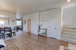 Thornton townhouse for rent - A living room with a dining table and chairs.
