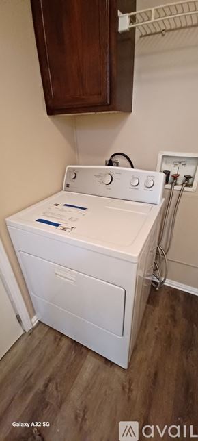 Kaufman house for rent - A white washing machine in a laundry room.