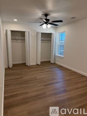 Arlington townhouse for rent - A room with a ceiling fan and wooden flooring.