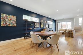 Dallas townhouse for rent - A dining room with a wooden table and chairs.