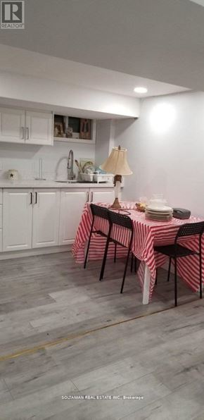 Toronto (West Hill) house for rent - A dining room with a table set for a meal.