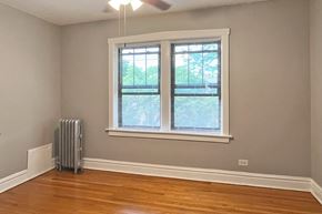Oak Park apartment for rent - A room with a window and a fan.