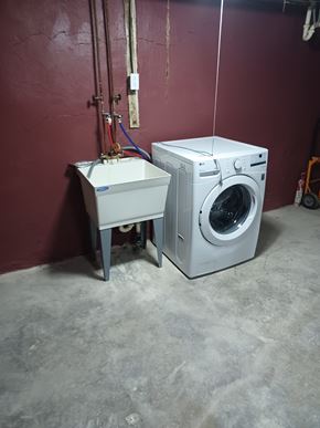 Philadelphia house for rent - A washing machine and dryer are sitting next to each other in a room.