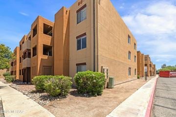 Tucson house for rent - A large building with a red container in front of it.