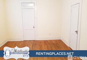 Augusta house for rent - A white house with a porch and a sign for McGillieuddy Renting Places.