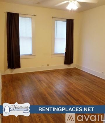 Augusta house for rent - A kitchen with white cabinets and a stainless steel oven.