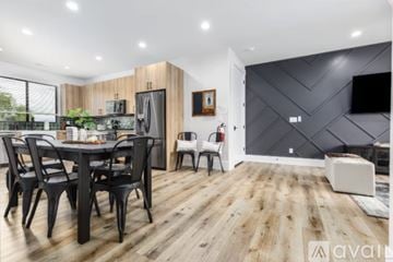 Hurricane house for rent - A modern kitchen with a dining table set for four.