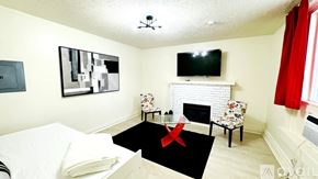 South Salt Lake apartment for rent - A bedroom with a bed, chair, and television.