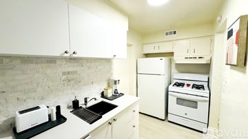 South Salt Lake apartment for rent - A kitchen with white cabinets and a white oven.