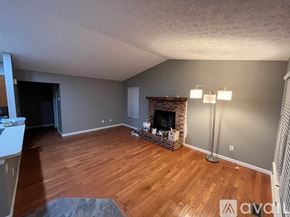 Columbus house for rent - A living room with a fireplace and a grey wall.