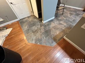 Columbus house for rent - A kitchen with a tile floor and wooden flooring.