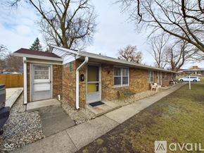 Anderson apartment for rent - A room with a carpeted floor and two windows.