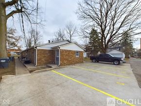 Anderson apartment for rent - A parking lot with a building and a truck.