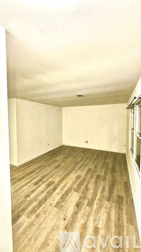 Anderson apartment for rent - A kitchen with black cabinets and a white door.