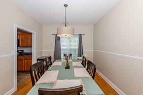 Jacksonville house for rent - A dining room with a table set for a meal.