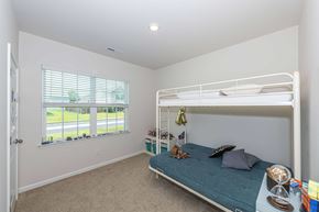 New Bern house for rent - A bedroom with a bunk bed and a window with blinds.
