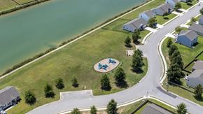 New Bern house for rent - A playground with a blue and white slide is surrounded by houses.