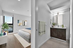 Los Angeles apartment for rent - A modern bedroom with a large bed and a separate bathroom area.