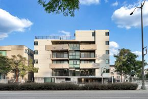 Los Angeles apartment for rent - A modern building with a flat roof and large windows.