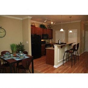 Midway Park apartment for rent - a kitchen and a dining room with a table and chairs
