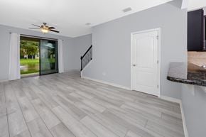 Clearwater house for rent - A room with a ceiling fan and a marble countertop.