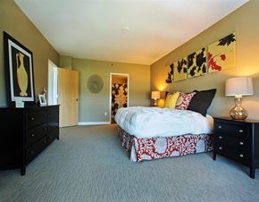 Clayton apartment for rent - a bedroom with a bed and two night stands