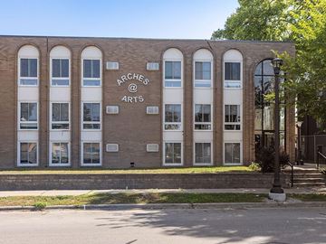Minneapolis apartment for rent - A building with the words "Arches @ Arts" on it.