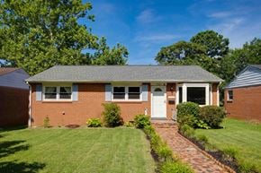Richmond house for rent - A red brick house with a white door and windows.