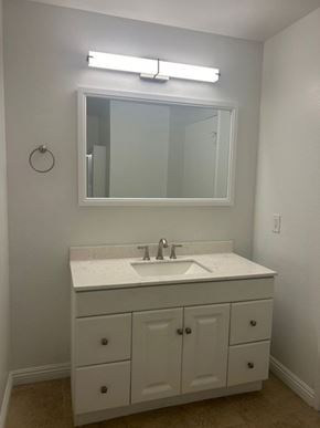 Glendale apartment for rent - A bathroom with a white sink and a mirror above it.