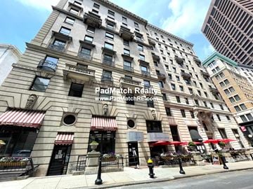 Boston apartment for rent - A street view of a building with the sign "PadMatch Realty" on the front.