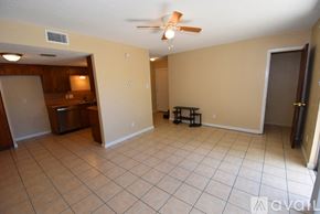 Ingleside apartment for rent - A living room with a tile floor and a ceiling fan.