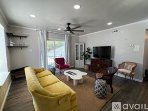 San Antonio condo for rent - A kitchen with a granite countertop and white cabinets.