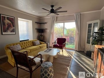 San Antonio condo for rent - A kitchen with a black stove top oven and white cabinets.