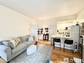 Boston apartment for rent - A bedroom with a zebra print bedspread and a white wardrobe.