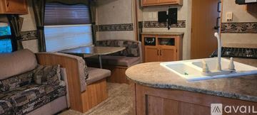 Homestead apartment for rent - A kitchen area with a table and chairs is available.