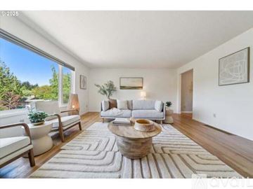 Portland house for rent - A living room with a white couch and a rug.