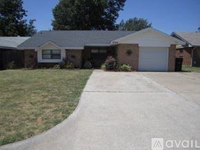 Oklahoma City house for rent - A house with a driveway in front of it.