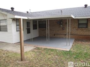 Oklahoma City house for rent - A house with a white exterior and a covered patio area.