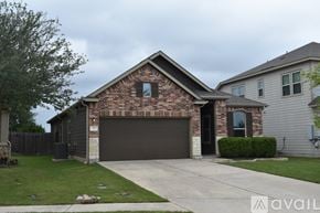 Leander house for rent - A house with a garage and a driveway.