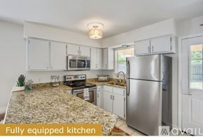Panama City Beach townhouse for rent - A fully equipped kitchen with granite countertops and stainless steel appliances.
