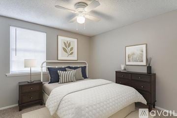 Nashville apartment for rent - A living room with a grey couch and a fireplace.