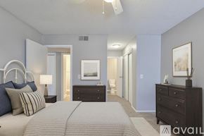 Nashville apartment for rent - A spacious room with wooden flooring and a white wall.